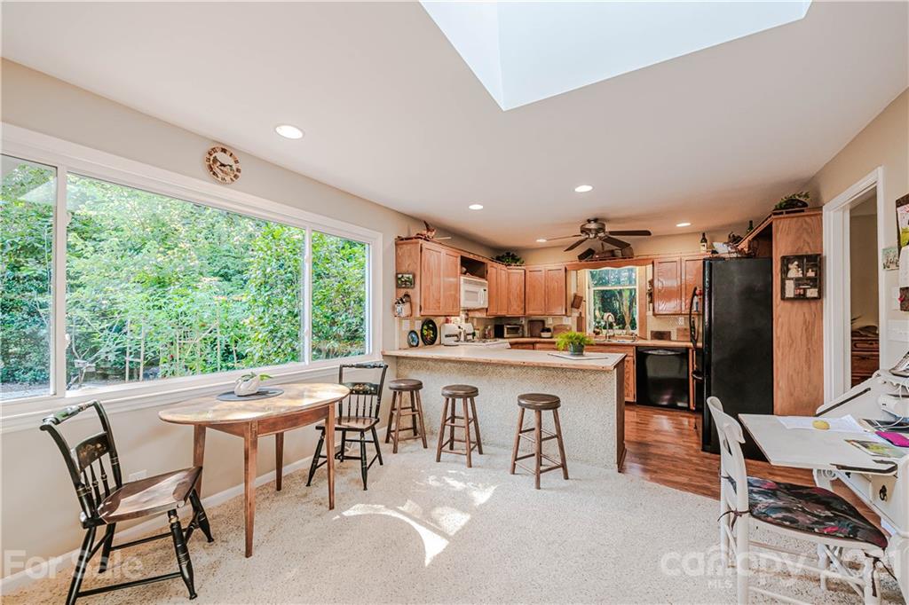 23055 Point Clear Drive, Unit 5 Tega Cay, SC 29708 - Photo 13 of 45 a kitchen with a table chairs and entryway