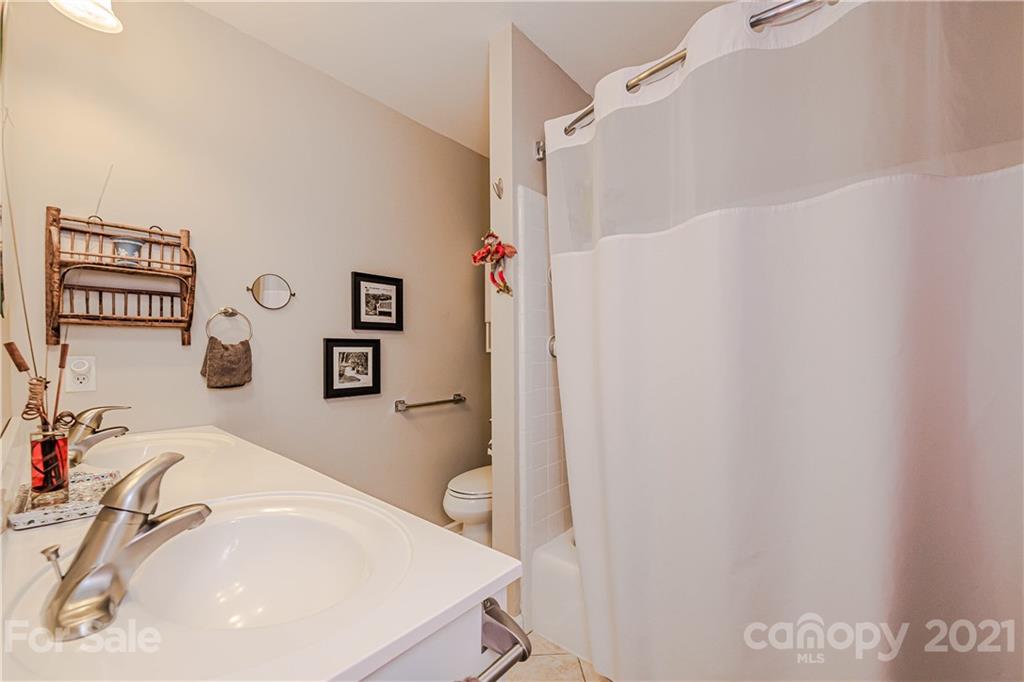 23055 Point Clear Drive, Unit 5 Tega Cay, SC 29708 - Photo 22 of 45 a bathroom with a sink and a tub