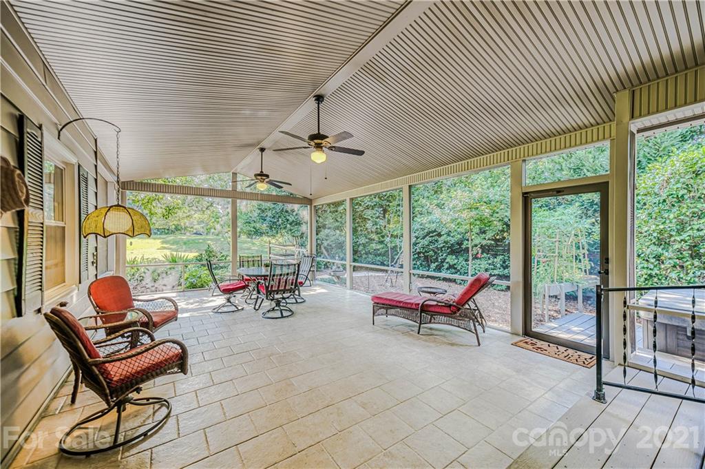 23055 Point Clear Drive, Unit 5 Tega Cay, SC 29708 - Photo 29 of 45 a building outdoor space with patio furniture and garden