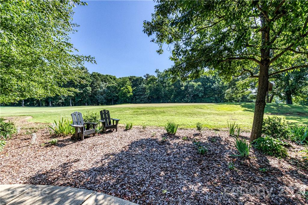 23055 Point Clear Drive, Unit 5 Tega Cay, SC 29708 - Photo 33 of 45 a view of a swimming pool and a yard