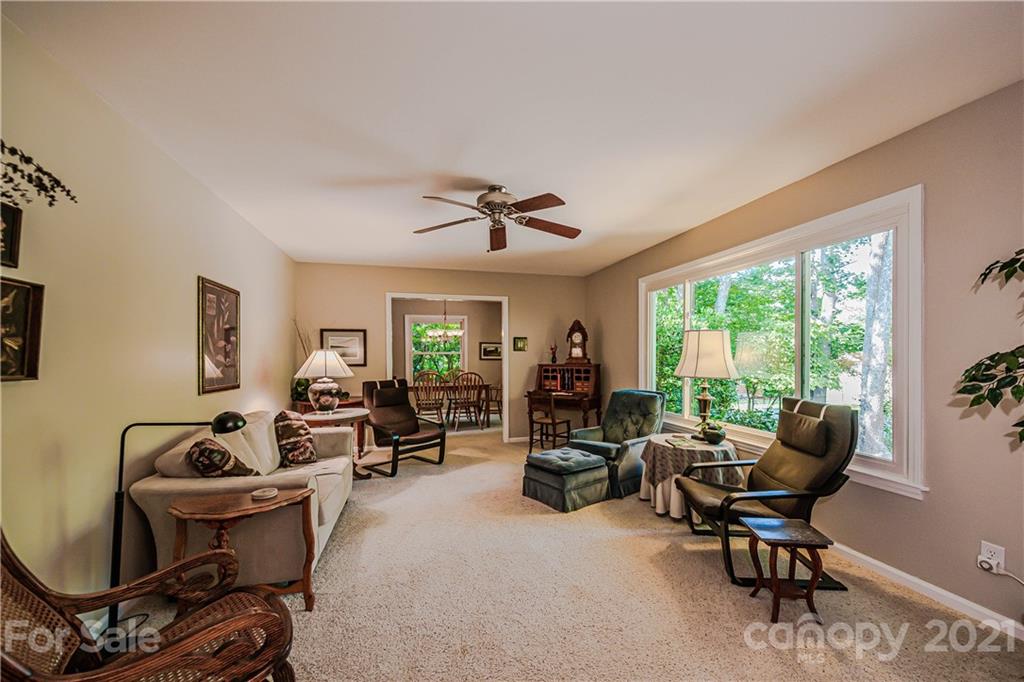 23055 Point Clear Drive, Unit 5 Tega Cay, SC 29708 - Photo 5 of 45 a living room with furniture and a window