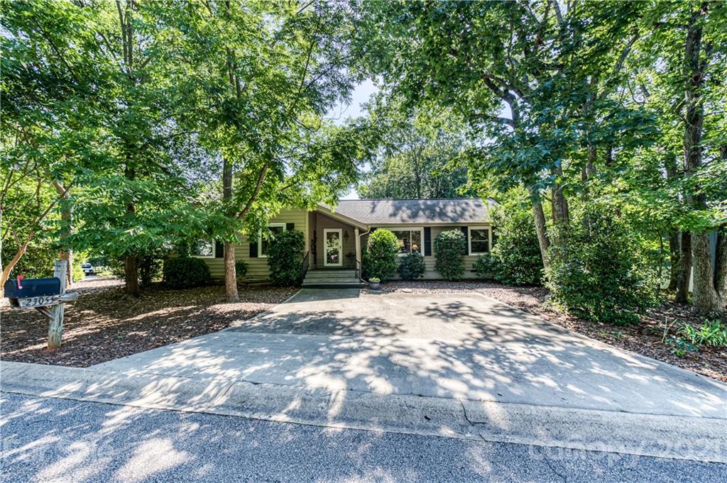 23055 Point Clear Drive, Unit 5 Tega Cay, SC 29708 - Photo 45 of 45 a front view of a house with a yard