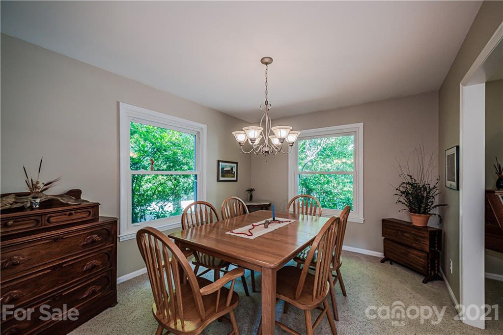 23055 Point Clear Drive, Unit 5 Tega Cay, SC 29708 - Photo 6 of 45 a view of a dining room with furniture window and outside view