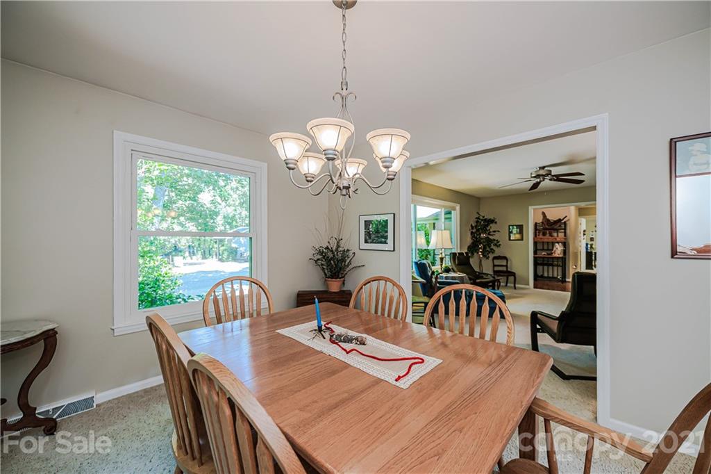 23055 Point Clear Drive, Unit 5 Tega Cay, SC 29708 - Photo 7 of 45 a view of a dining room with furniture window and outside view