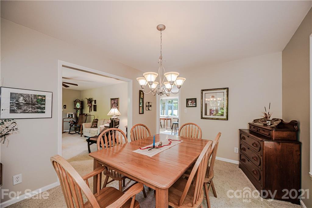 23055 Point Clear Drive, Unit 5 Tega Cay, SC 29708 - Photo 8 of 45 a dining room with furniture and window