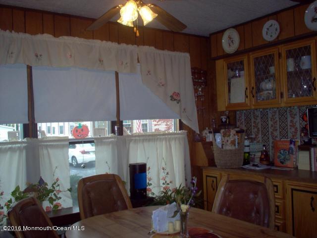 113 Village Road Morganville, NJ 07751 - Photo 3 of 7 a kitchen with a table and chairs in it