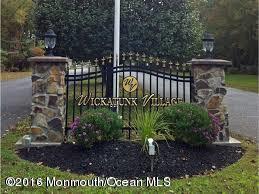 113 Village Road Morganville, NJ 07751 - Photo 7 of 7 a view of a garden with wooden bench