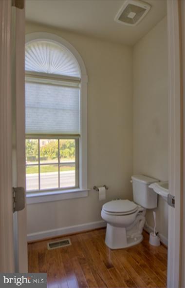 7652 Telamon Way Hanover, MD 21076 - Photo 18 of 34 a bathroom with a toilet and a window
