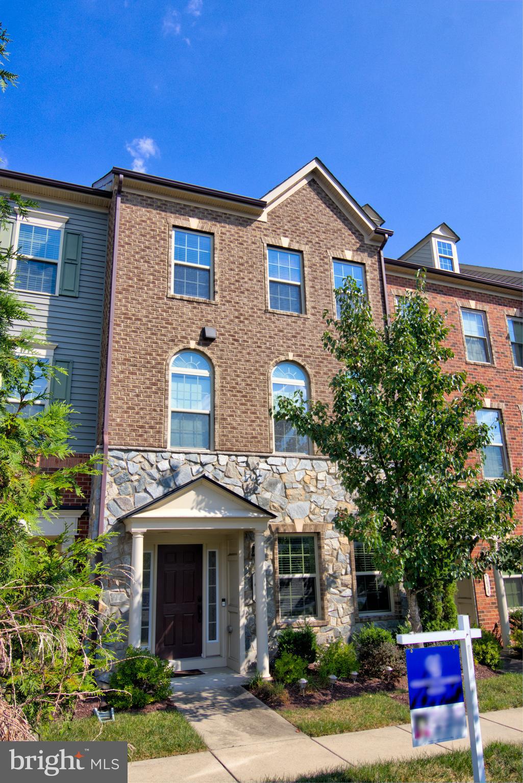 7652 Telamon Way Hanover, MD 21076 - Photo 2 of 34 a front view of a house with yard