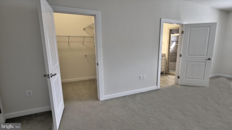 7652 Telamon Way Hanover, MD 21076 - Photo 24 of 34 an empty room with windows and closet