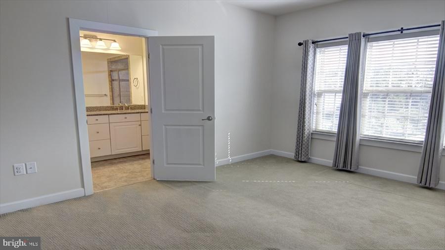 7652 Telamon Way Hanover, MD 21076 - Photo 26 of 34 an empty room with windows