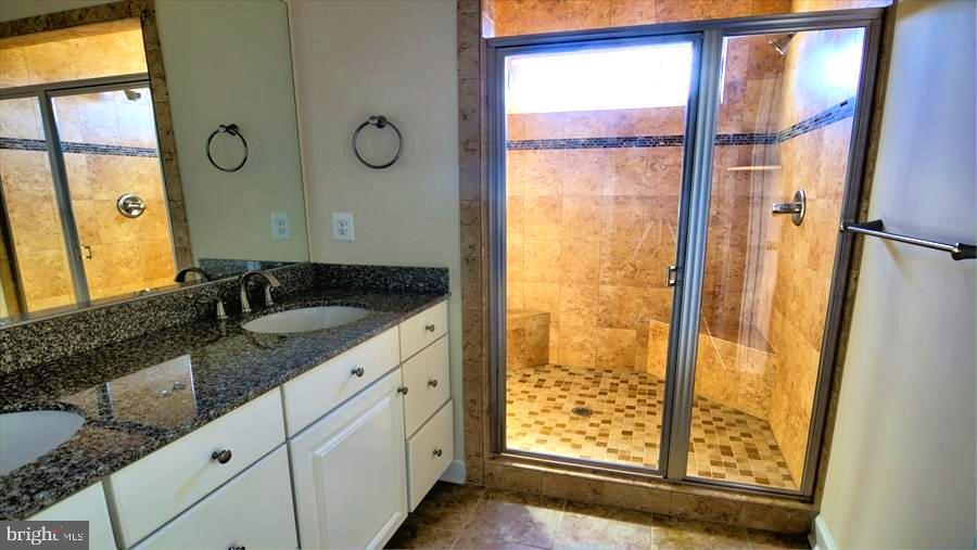 7652 Telamon Way Hanover, MD 21076 - Photo 28 of 34 a bathroom with a granite countertop sink and a mirror