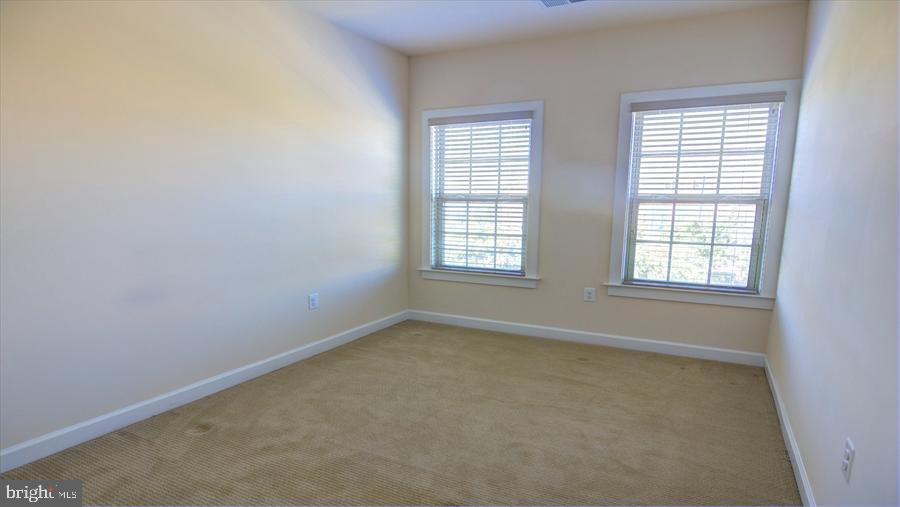 7652 Telamon Way Hanover, MD 21076 - Photo 30 of 34 an empty room with windows
