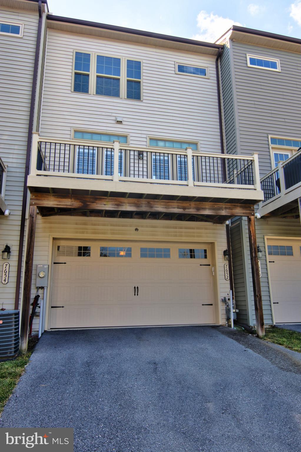 7652 Telamon Way Hanover, MD 21076 - Photo 34 of 34 a view of a house with a barbeque and wooden fence