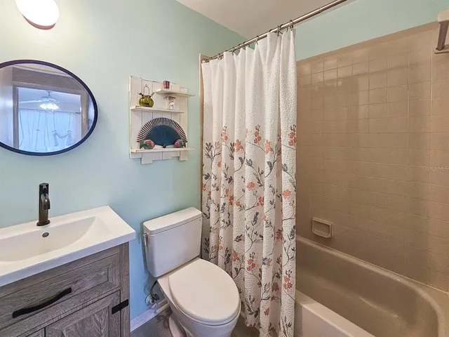 a bathroom with a toilet a sink and bathtub