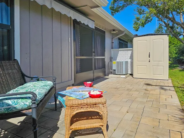 a backyard of a house with seating space