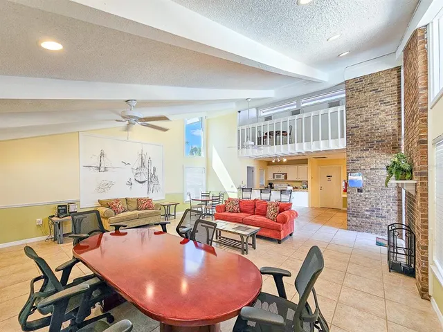 a dining room with furniture window and wooden floor
