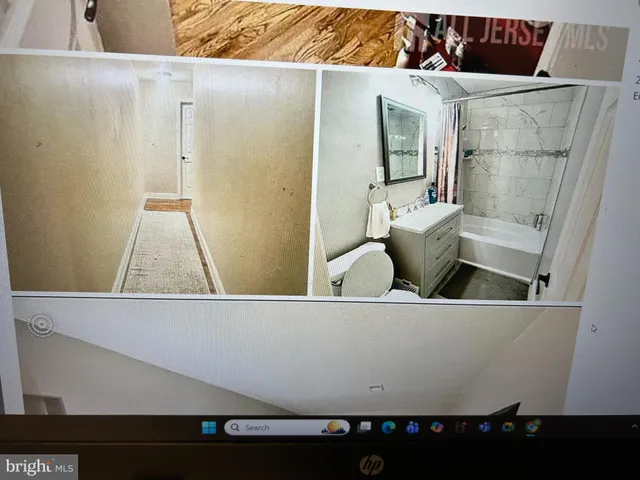 a view of a living room with a wooden floor