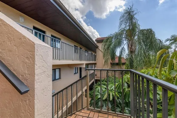 a view of a balcony with plants
