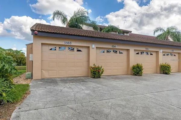 a front view of a house with a garage