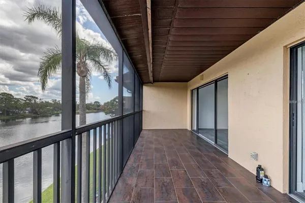a view of a porch with wooden floor