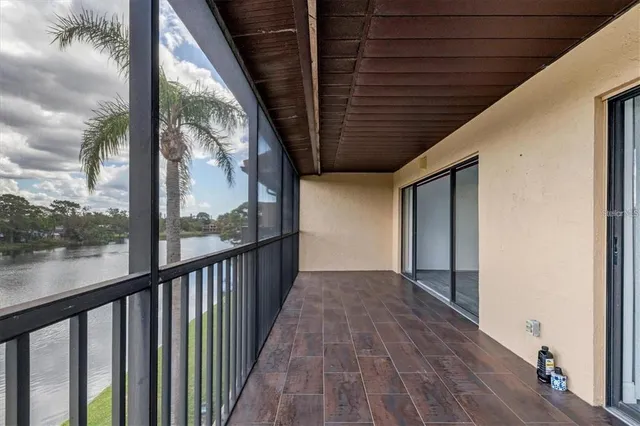 a view of a porch with wooden floor