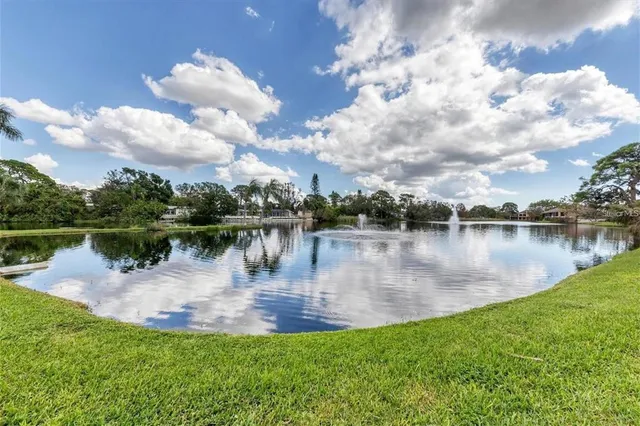 a view of a lake with a yard