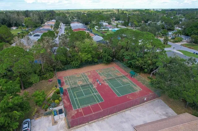 an aerial view of house with yard