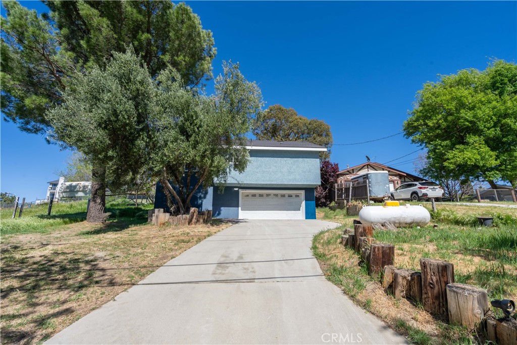 42640 Ranch Club Road Lake Hughes, CA 93532 - Photo 21 of 27 a view of a house with a yard and front door