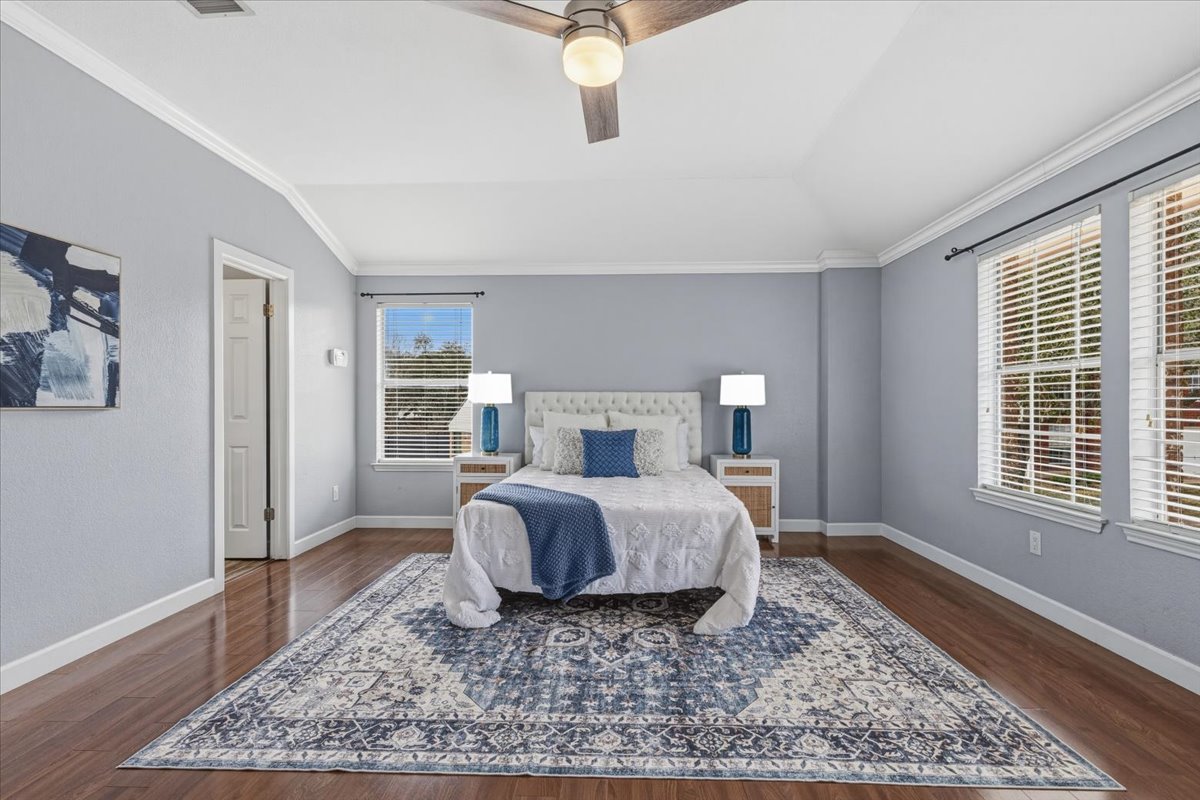 8103 Red Rock Cove Austin, TX 78749 - Photo 18 of 33 a bed room with a bed and wooden floor