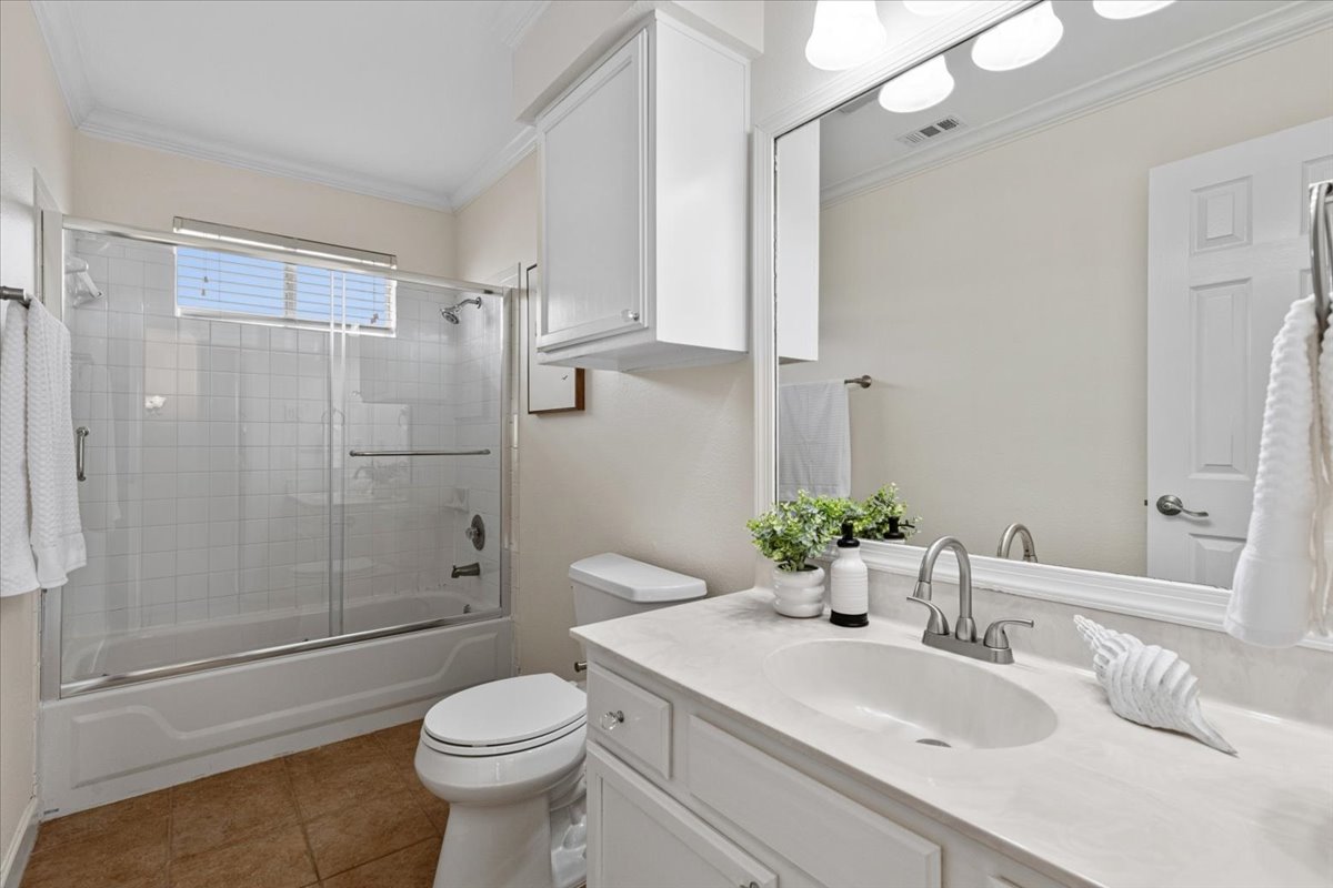 8103 Red Rock Cove Austin, TX 78749 - Photo 24 of 33 a bathroom with a sink toilet and shower