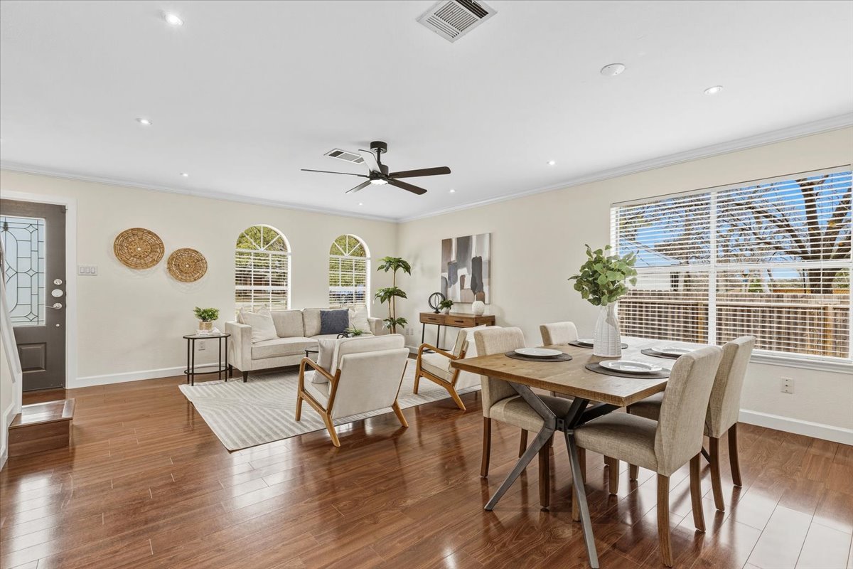 8103 Red Rock Cove Austin, TX 78749 - Photo 7 of 33 a view of a dining room with furniture window and wooden floor
