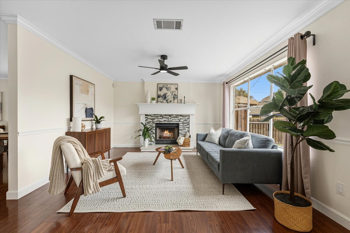 8103 Red Rock Cove Austin, TX 78749 - Photo 9 of 33 a living room with furniture potted plant and a fireplace