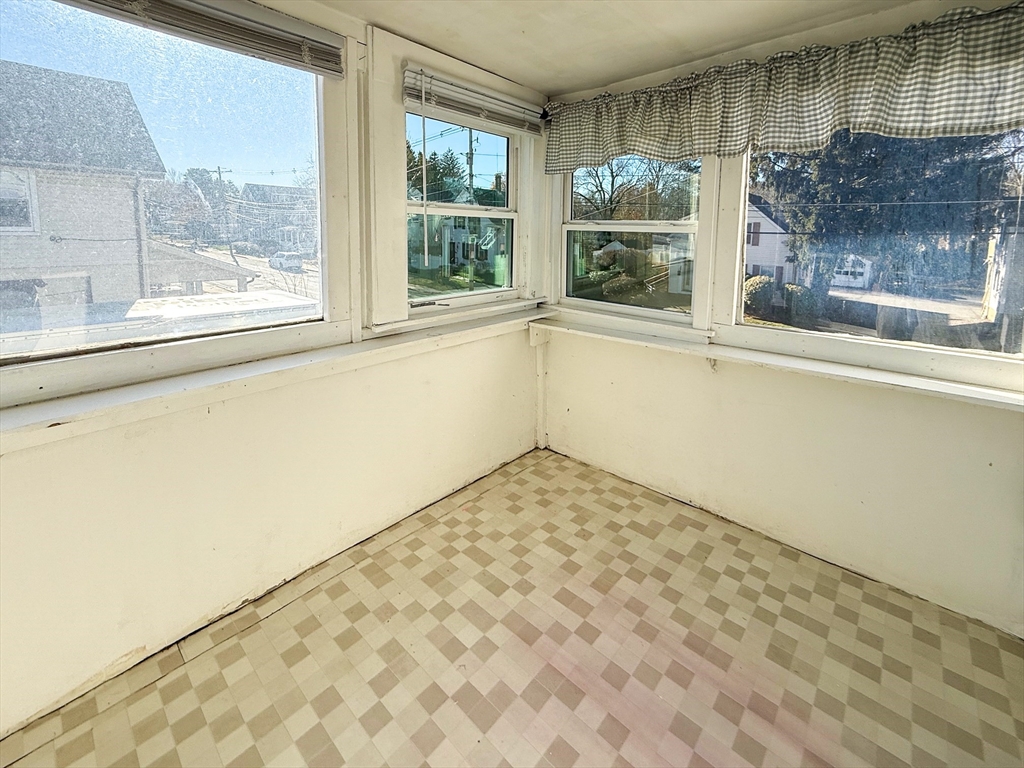 258-260 Main Street, Unit 2 Ashland, MA 01721 - Photo 2 of 10 a view of empty room with wooden floor and fan