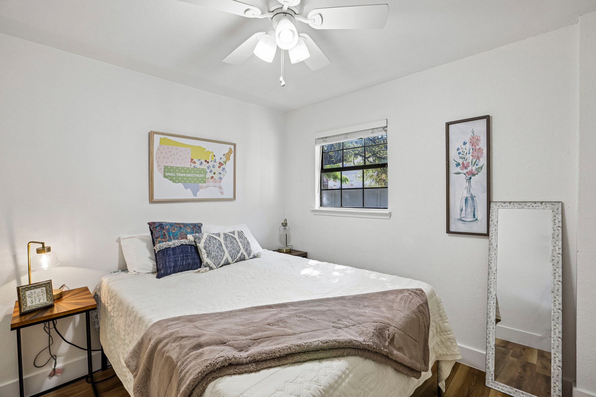 16725 Whitebrush Loop Austin, TX 78717 - Photo 13 of 32 Bedroom 3; Comfortable bedroom features a window and modern ceiling fan for serene living.