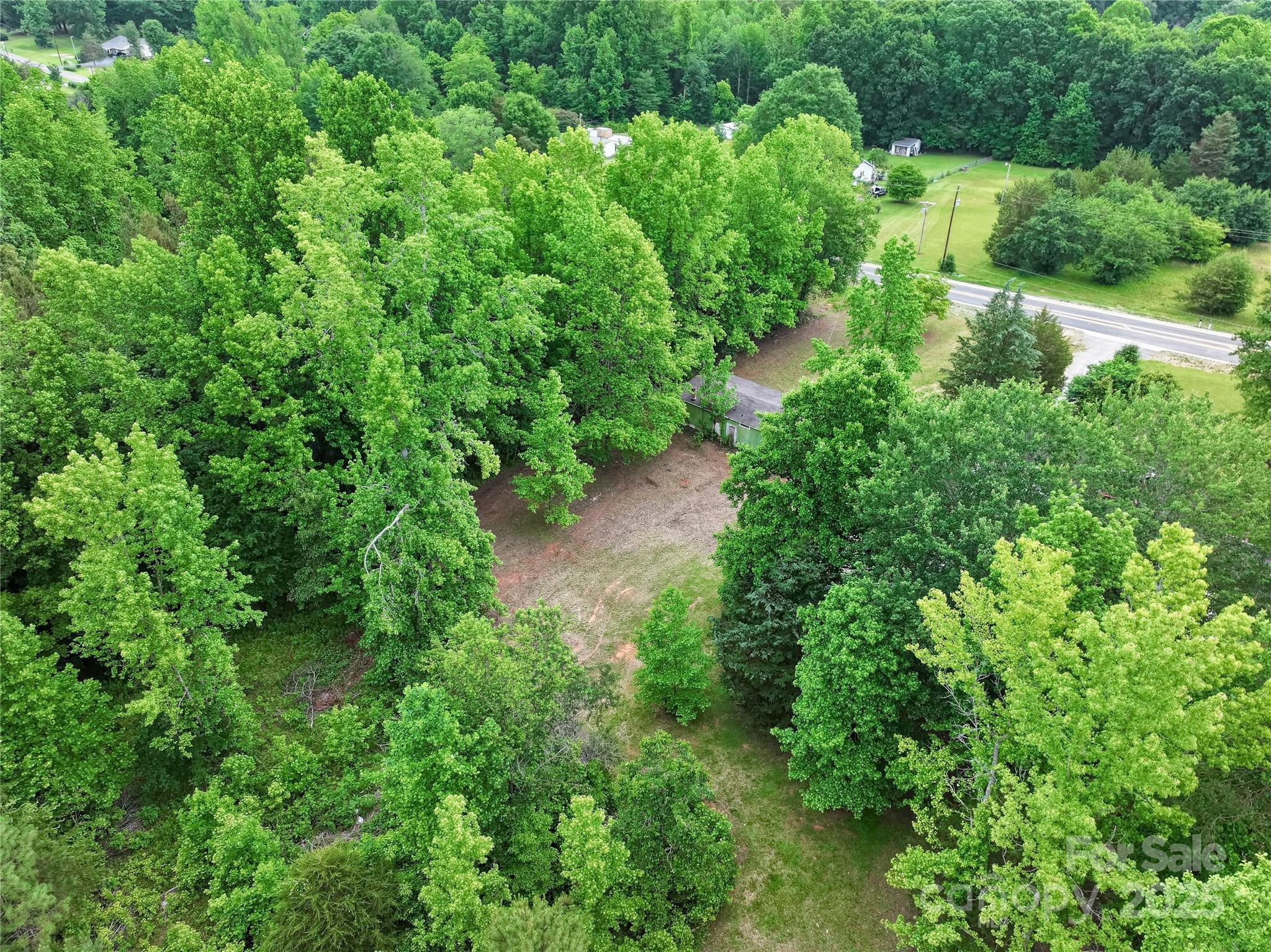 1317 Requa Road Cherryville, NC 28021 - Photo 6 of 14 an aerial view of residential house with outdoor space and trees all around
