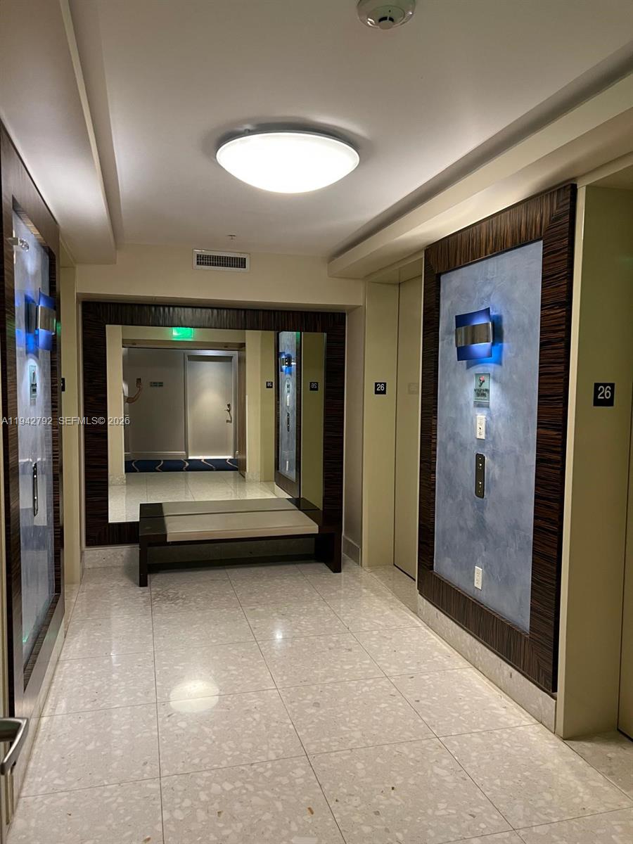185 Southwest 7th Street, Unit 2601 Miami, FL 33130 - Photo 14 of 17 a view of an empty room with glass door and shower