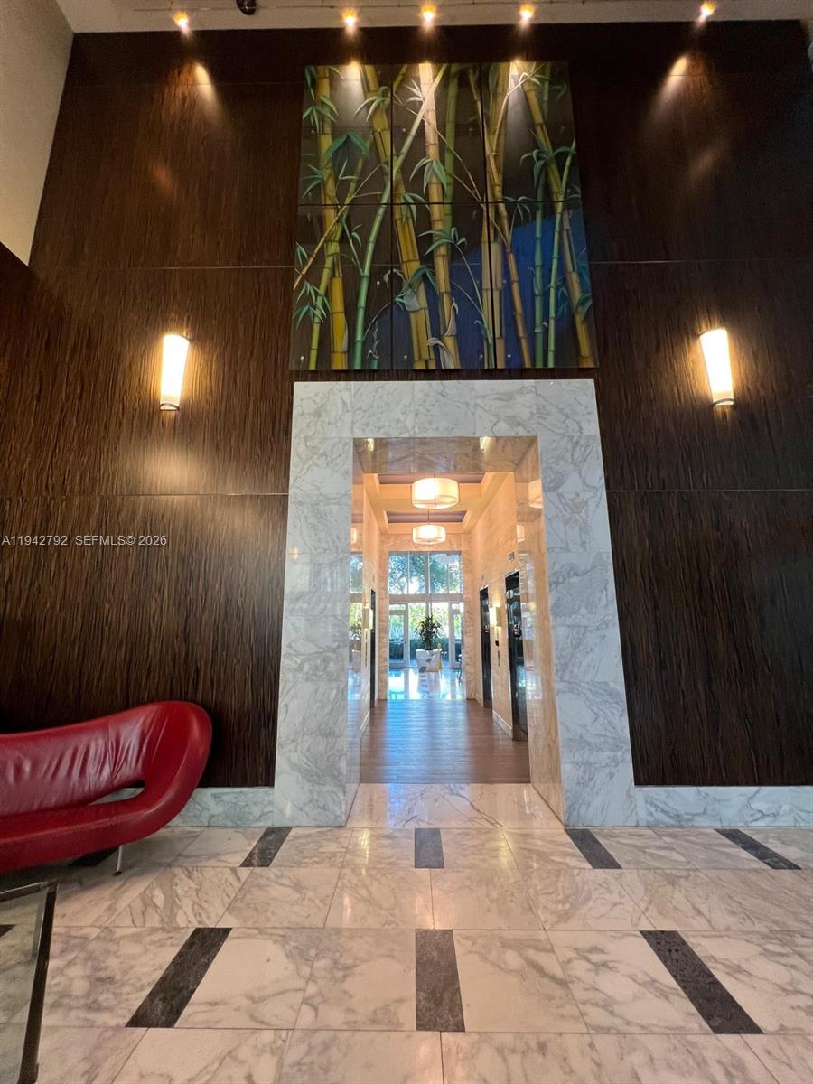 185 Southwest 7th Street, Unit 2601 Miami, FL 33130 - Photo 17 of 17 a view of a hallway with wooden floor