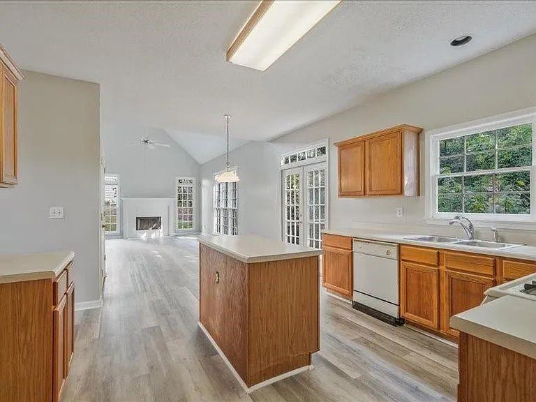 4382 Oakleaf Cove Decatur, GA 30034 - Photo 11 of 27 a kitchen with stainless steel appliances granite countertop a stove and wooden floor