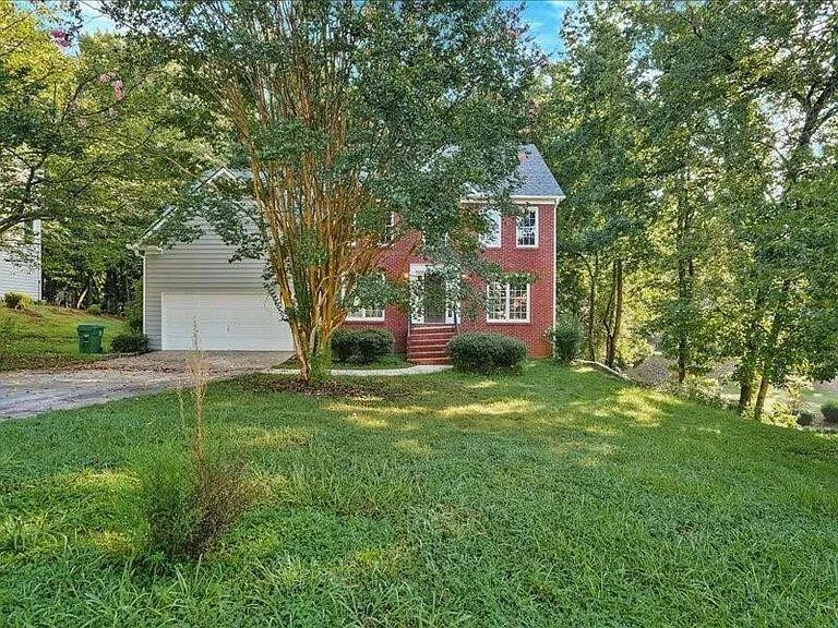 4382 Oakleaf Cove Decatur, GA 30034 - Photo 2 of 27 a front view of a house with garden