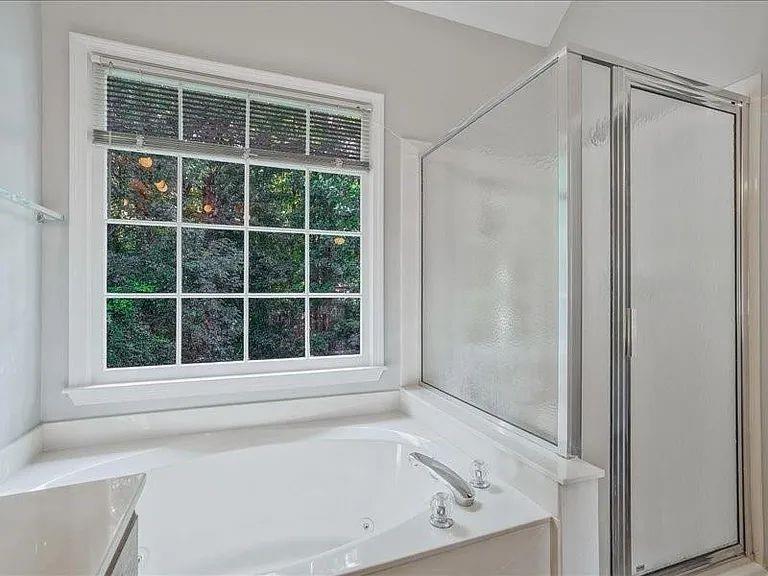 4382 Oakleaf Cove Decatur, GA 30034 - Photo 21 of 27 a view of a bathroom with a bathtub