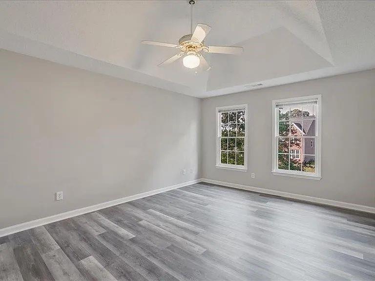 4382 Oakleaf Cove Decatur, GA 30034 - Photo 7 of 27 wooden floor in an empty room with a window