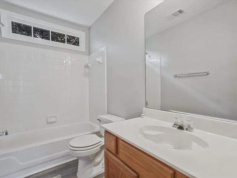 4382 Oakleaf Cove Decatur, GA 30034 - Photo 9 of 27 a bathroom with a sink a toilet and shower