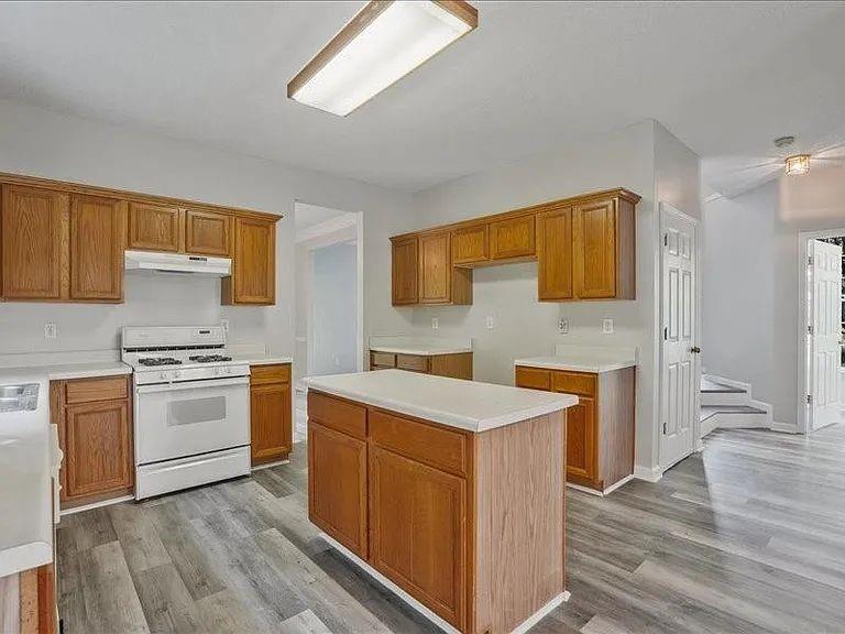 4382 Oakleaf Cove Decatur, GA 30034 - Photo 10 of 27 a kitchen with a stove top oven sink and cabinets