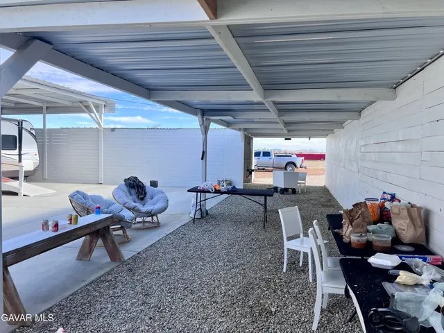 a view of a red door in the backyard