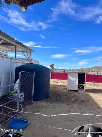 a view of a backyard of the house