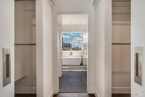 a bathroom with a bathtub and window