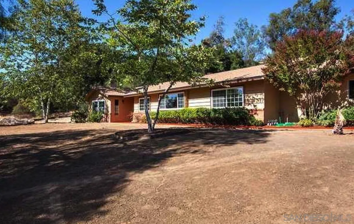 28325 Valley Center Road Valley Center, CA 92082 - Photo 1 of 1 a view of a house with a street