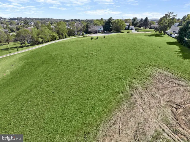 an aerial view of a house with outdoor space