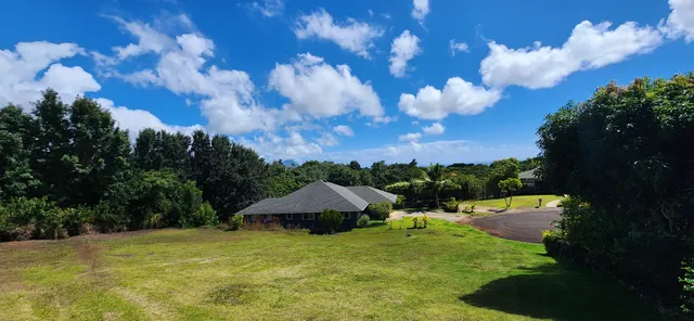 a view of a lake with a house in the background